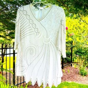 Beautifully beaded white top.